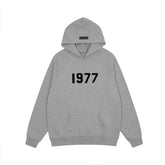 FEAR OF GOD FOG ESSENTIALS Flocked 1977 Loose High‑Street Hoodi