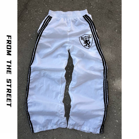 From THE STREET loose three bar shield badge nylon retro straight leg sports pants from the street